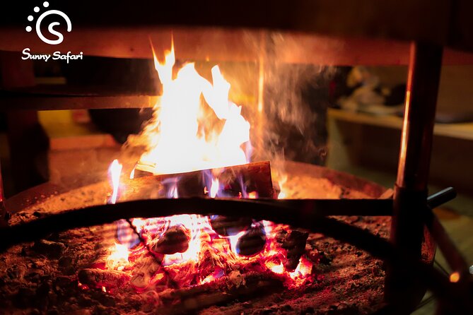 Aurora Borealis Trip in Lapland Lakeside - Campfire sausages and warm berry juice