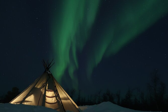 Enjoy the Aurora show on top of the mountain inc tipi dinner - Riding a snowmobile toward Mount Ednavaara