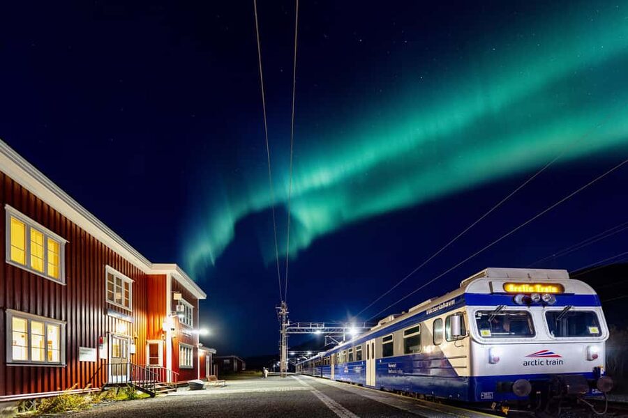 From Narvik: The Northern Lights Arctic Train Guided Tour - Fire, lavvu, hot drinks, and a cold Arctic night