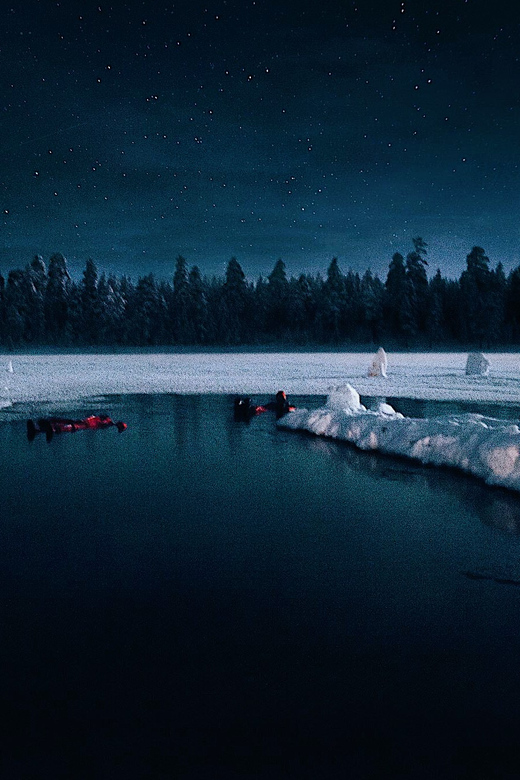 From Rovaniemi: Ice Floating under Aurora Borealis - Hot drinks, fire, and a Finnish-style pause