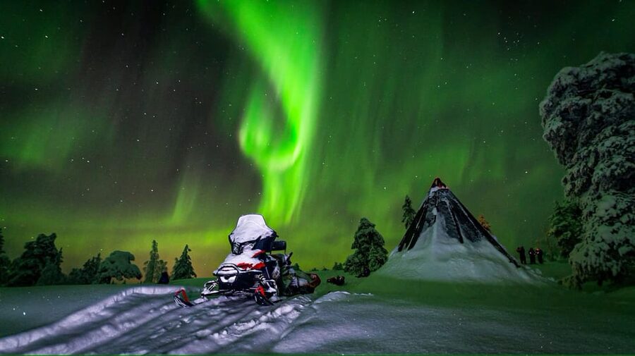 Inari: Northern Lights Hunt Snowmobile Safari - Riding through the dark Arctic forest