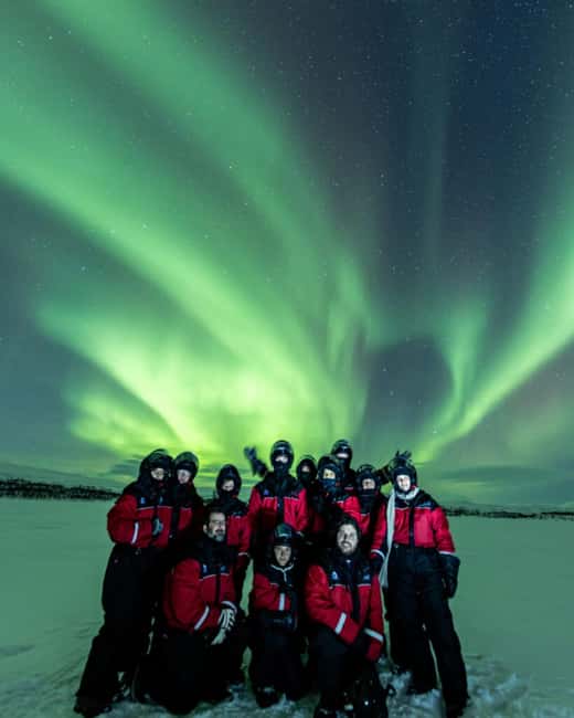 Kilpisjärvi: Northern Lights Snowmobile Tour with Photos - Campfire warmth, hot drinks, and a pastry