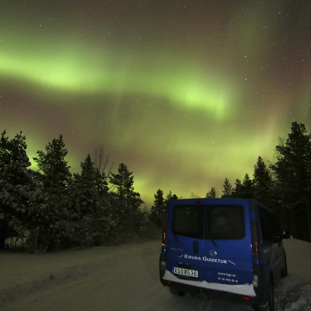Kiruna: Northern Lights Minivan Chase with Warm Drink - Waiting outdoors with a hot drink