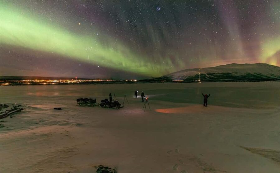 Kiruna: Northern Lights Snowmobile Tour - Riding through the snowy forest at night