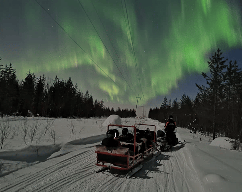 Levi: Northern Lights Sledge Ride - Riding behind a snowmobile