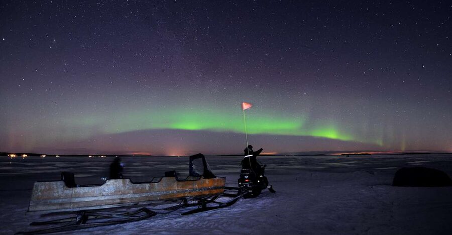 Luleå : Northern Lights Tour on a Snowmobile drawn Sled - A warm sled ride across the frozen sea