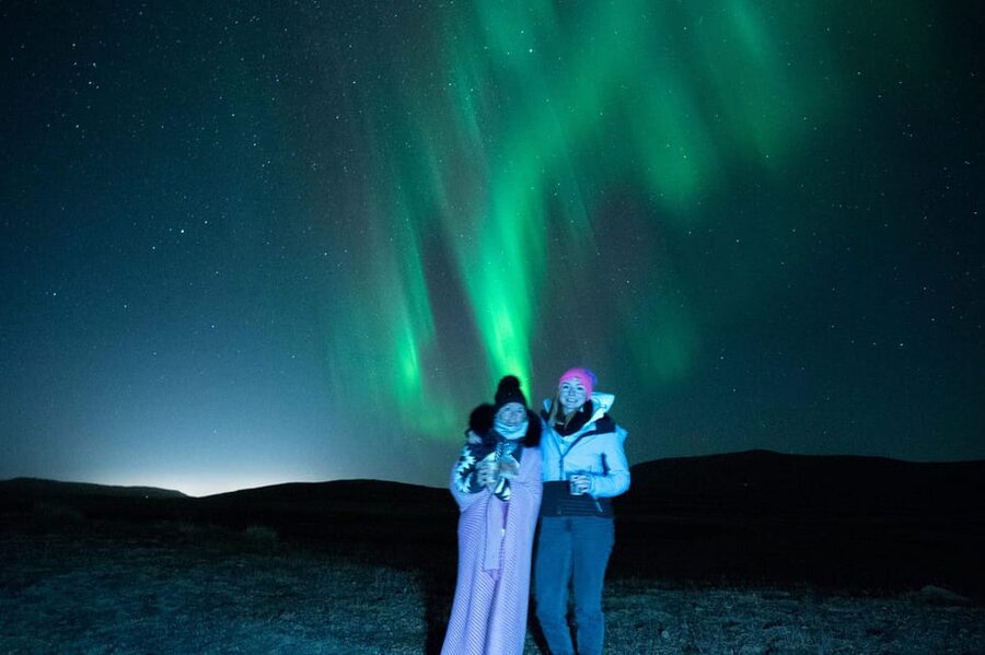 Northern Lights in Mini Bus, Photos, Hot Cocoa and Pastries - Cocoa, pastries, and blankets under the winter sky