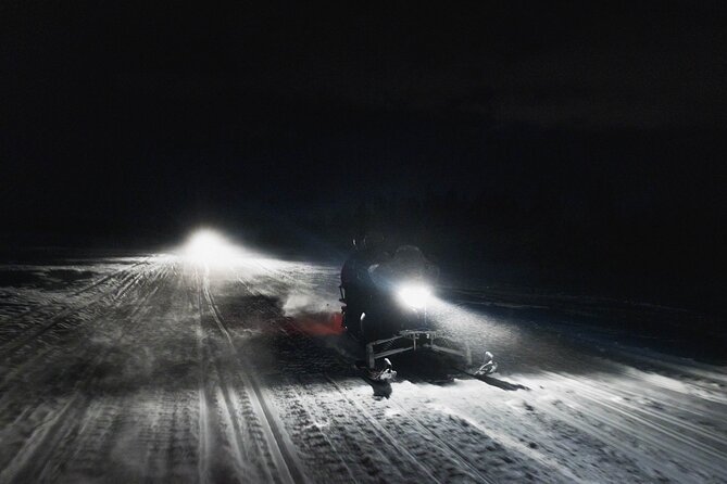 Northern lights safari by snowmobile - Getting dressed for a very cold ride