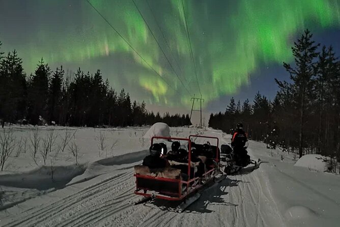 Northern Lights Sledge Ride in Levi - A snowmobile pulls you into darker country