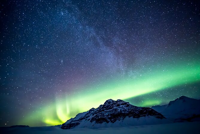 Northern Lights Small-Group Tour with Free Photos & Hot Chocolate - Finding the aurora through cloud and darkness