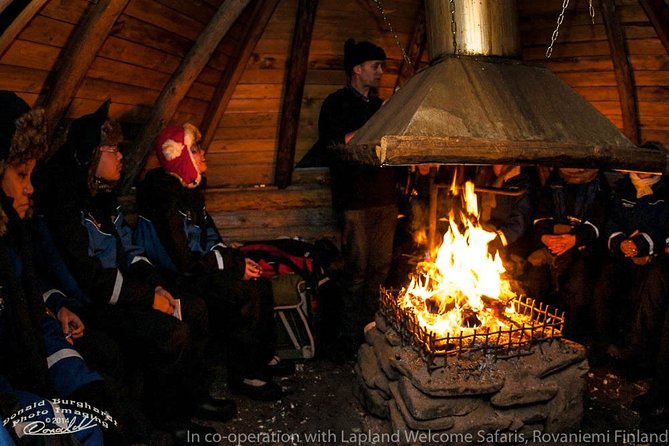 Northern Lights Snowmobile Driving Safari - The wooden tepee and the campfire break