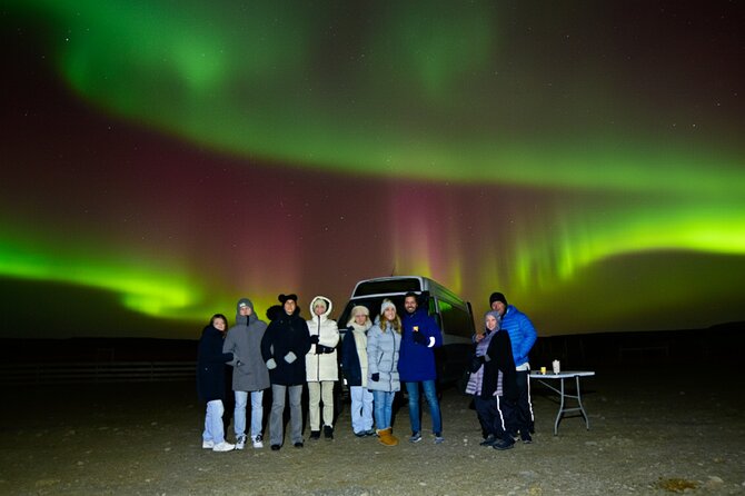 Northern Lights Tour: Cozy Night Adventure with Hot Chocolate - Waiting under Iceland’s dark sky