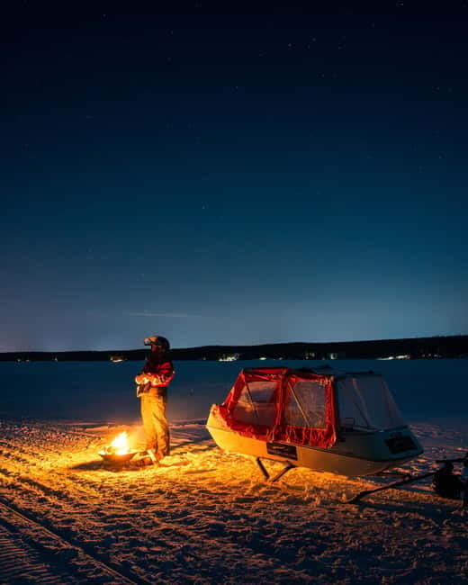 Northern Lights Tour Sleigh Ride - Warming up beside the teepee fire