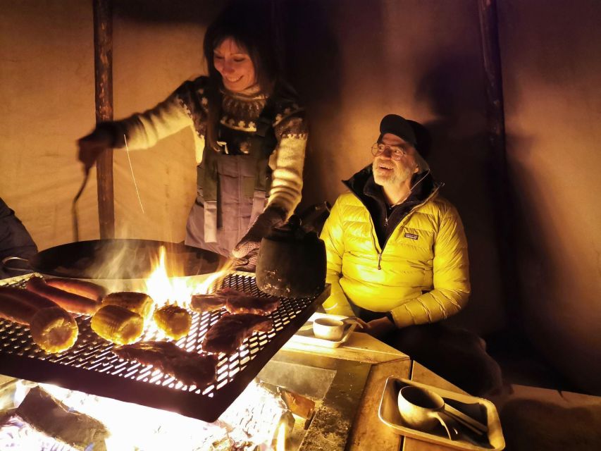 Premium Aurora Snowmobile Ride With Panoramic Views - A warm start in a fire-lit tipi