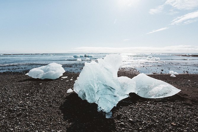 Private 2-Day Glacier Lagoon, Ice Cave and Northern Lights - Day one: waterfalls, black sand, and a canyon