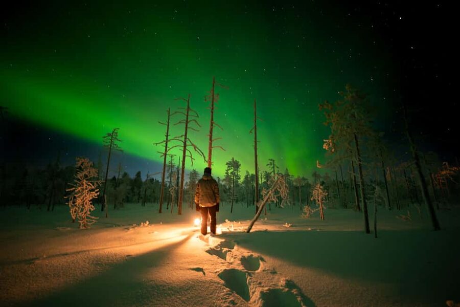 Ranua: Northern Lights tour with Campfire Meal & Pro Camera - In the van, the sky sets the plan