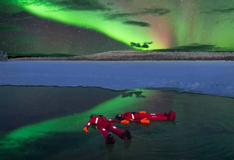 Rovaniemi: Ice Floating in Forest Lake with Aurora Borealis - Getting into the floating suit
