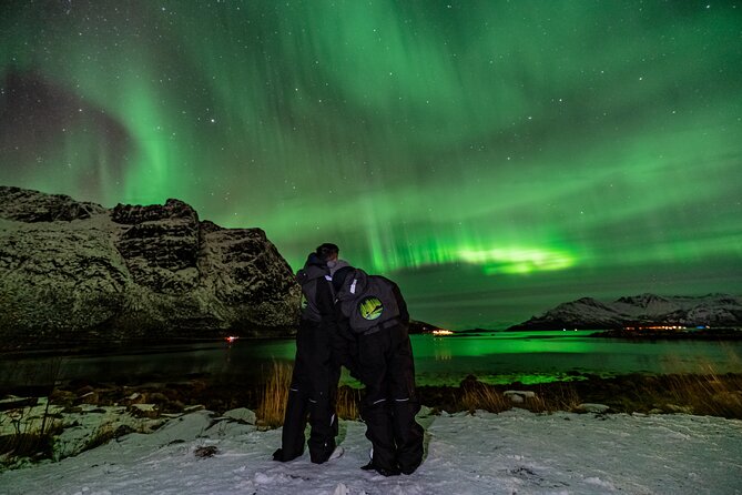 Tromsø Fjordland Aurora Chase Northern Lights by the Arctic Sea - The aurora over mountains and water