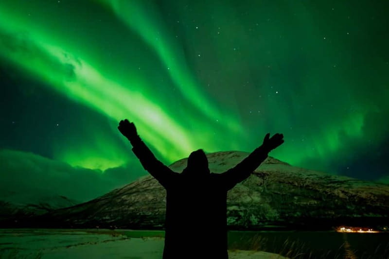 Tromsø: Northern Lights in a Minivan with Free Photos and a Hot Meal - Finding a dark place for the photo stop