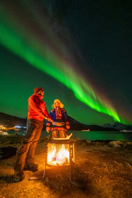 Tromsø: Northern Lights Tour with Sámi & local guides - Leaving Tromsø behind in a heated minibus